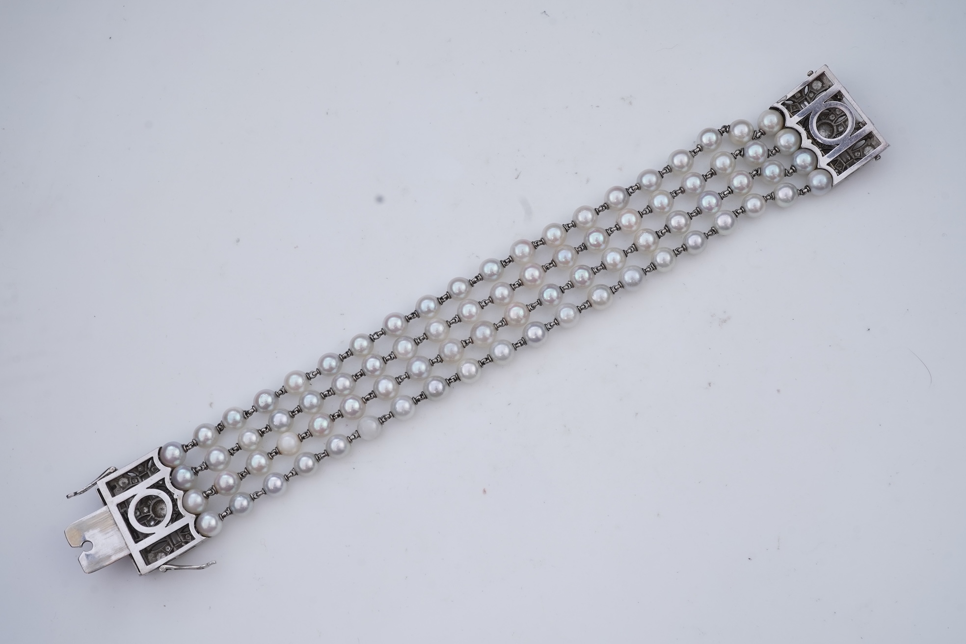 A cultured pearl and diamond bracelet